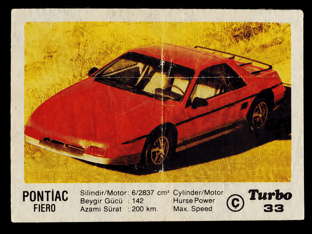 Turbo gum wrapper with red Pontiac Fiero sports car, vintage American car collectible insert