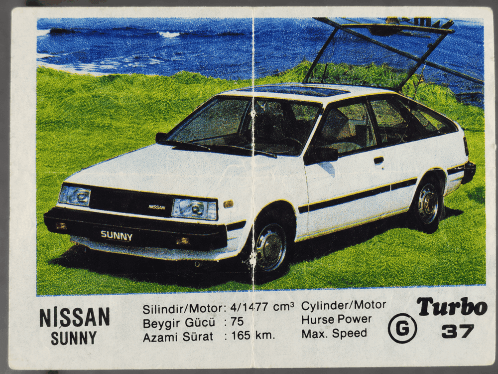 Turbo gum wrapper featuring white Nissan Sunny hatchback, vintage Japanese car collectible insert