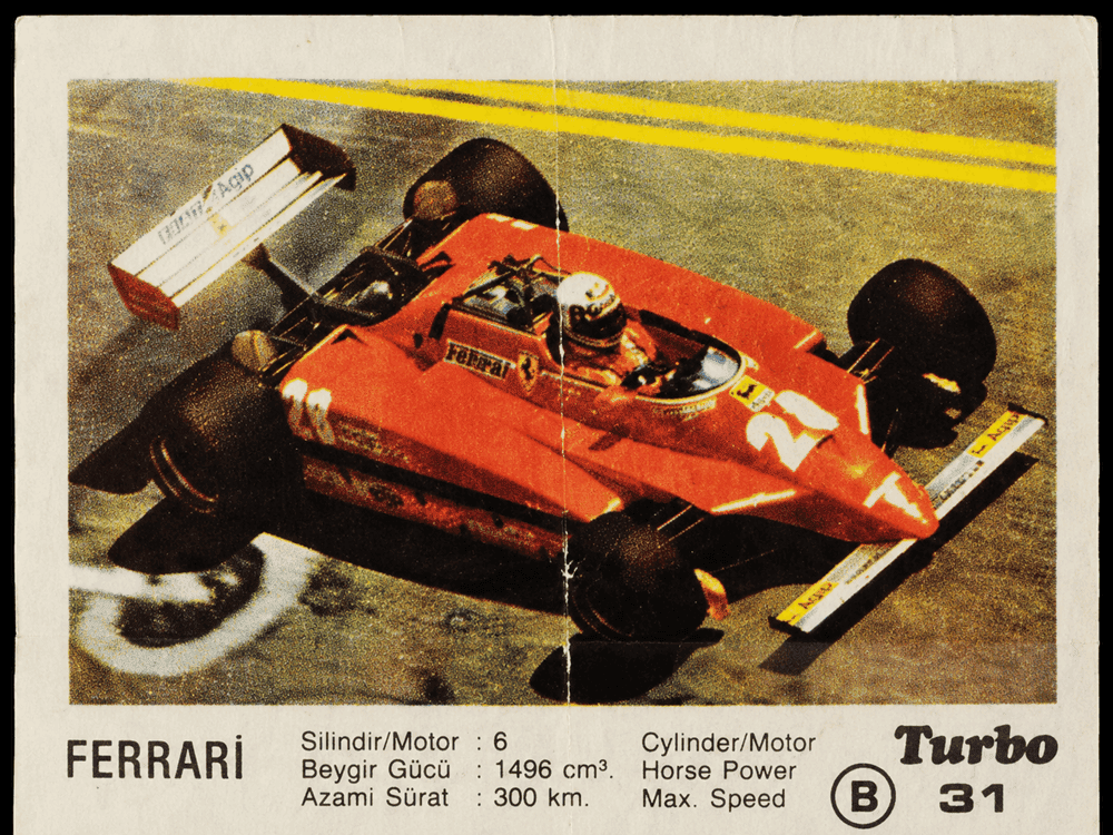 Turbo gum wrapper with red Ferrari Formula 1 racing car, vintage motorsport collectible insert