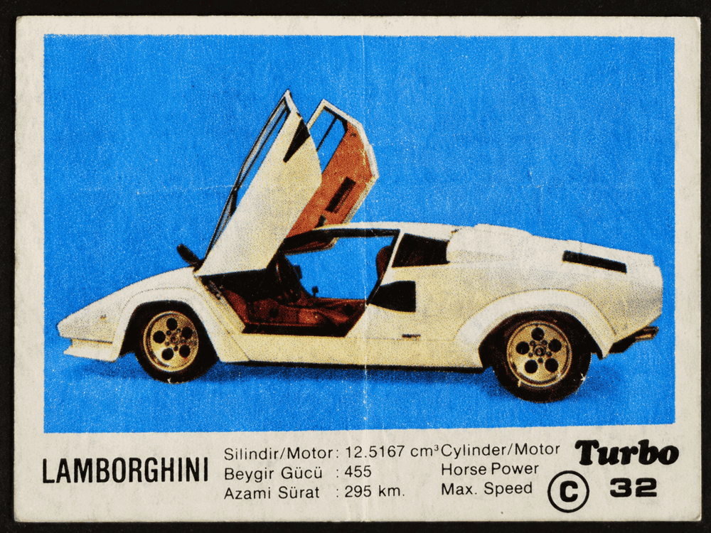 Turbo gum wrapper featuring white Lamborghini Countach with scissor door, vintage supercar insert